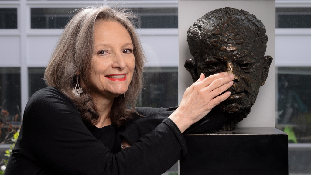 Mary Lou Aleskie with the bust of Warner Bentley in the Hop