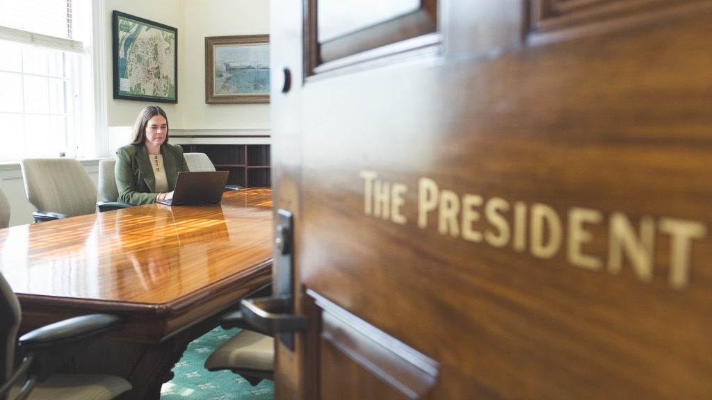 Sian Leah Beilock at her computer in the President's office
