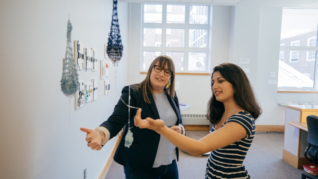 Professor Jacque Wernimont speaks with a students.